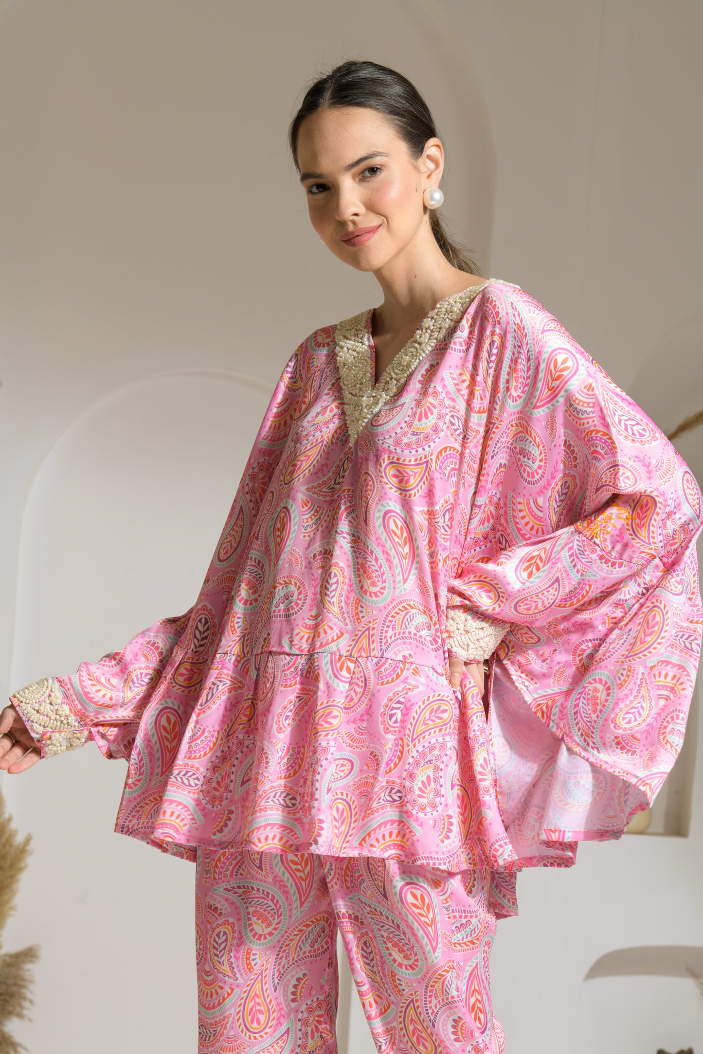Bahaar Pink Paisley Print Poncho style top with Embroidered pearl neckline and straight fit pants - Set of 2