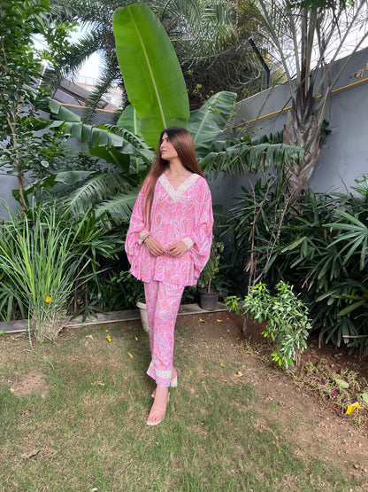 Bahaar Pink Paisley Print Poncho style top with Embroidered pearl neckline and straight fit pants - Set of 2